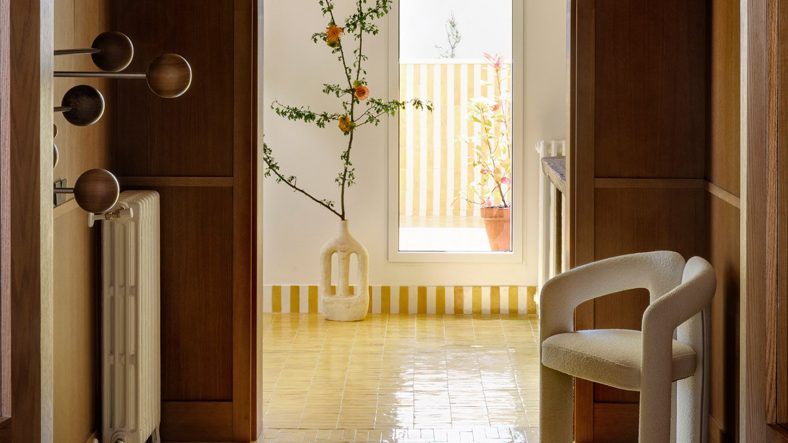 Vibrant glazed tiles divvy up Madrid apartment by Sierra + De La Higuera