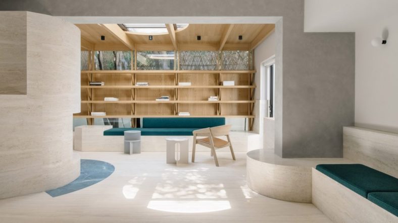 Atelier Tao+C creates serene timber and travertine reading room
