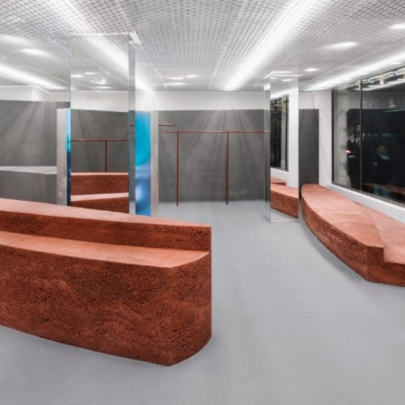 Gonzalez Haase AAS includes rammed-earth “islands” at clothing store