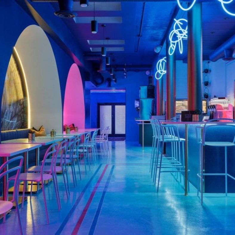 Neon lighting illuminates Strip Joint Chicken by Amanda Hamilton